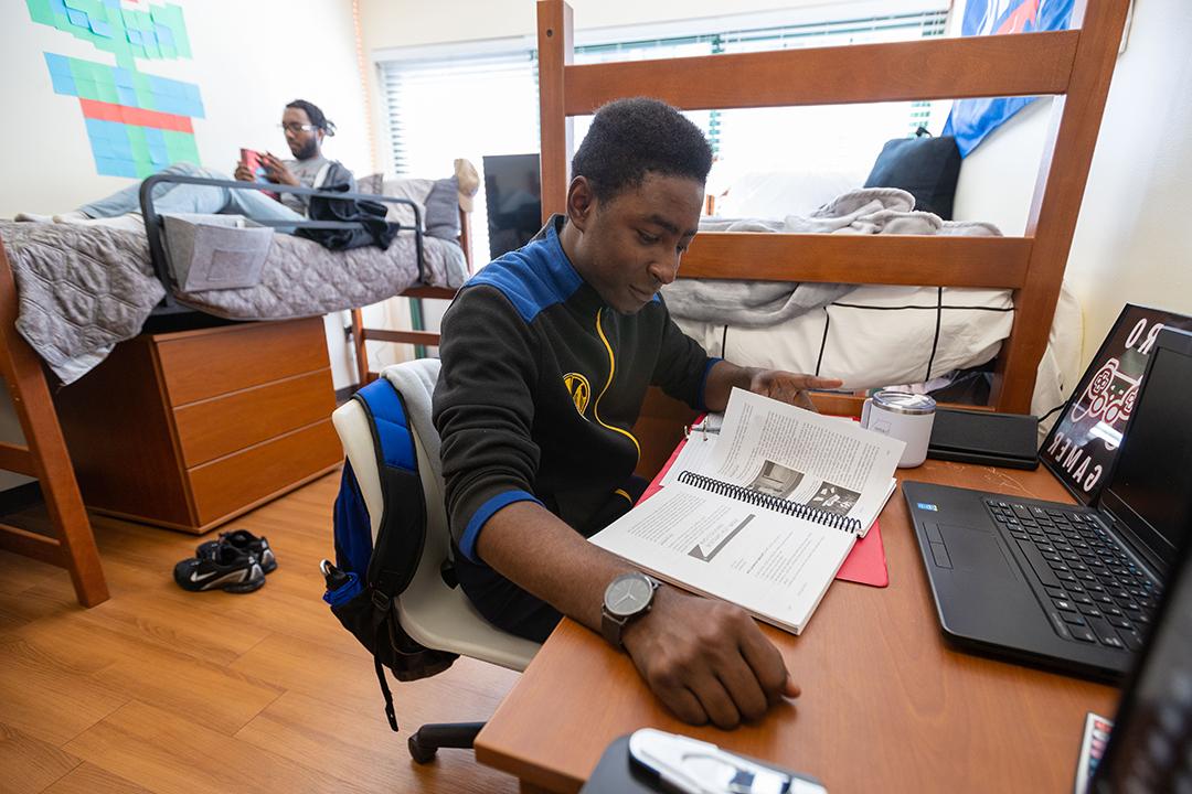 Roommates doing school work in room